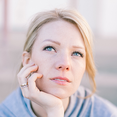 young woman contemplating a self managed super fund for securing her finances in retirement